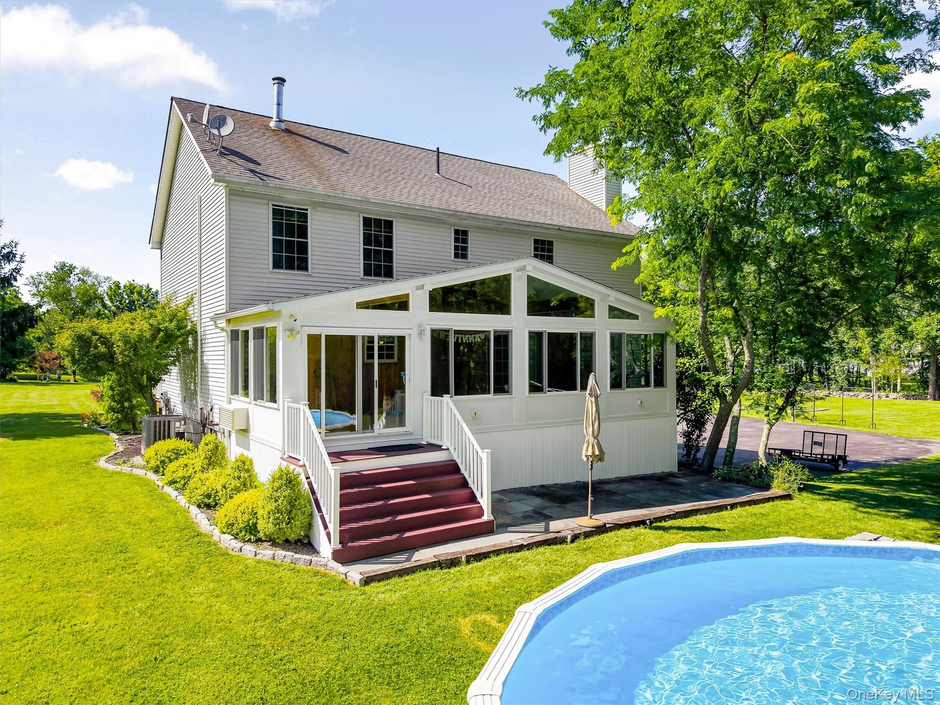 Rear view of home with pool.