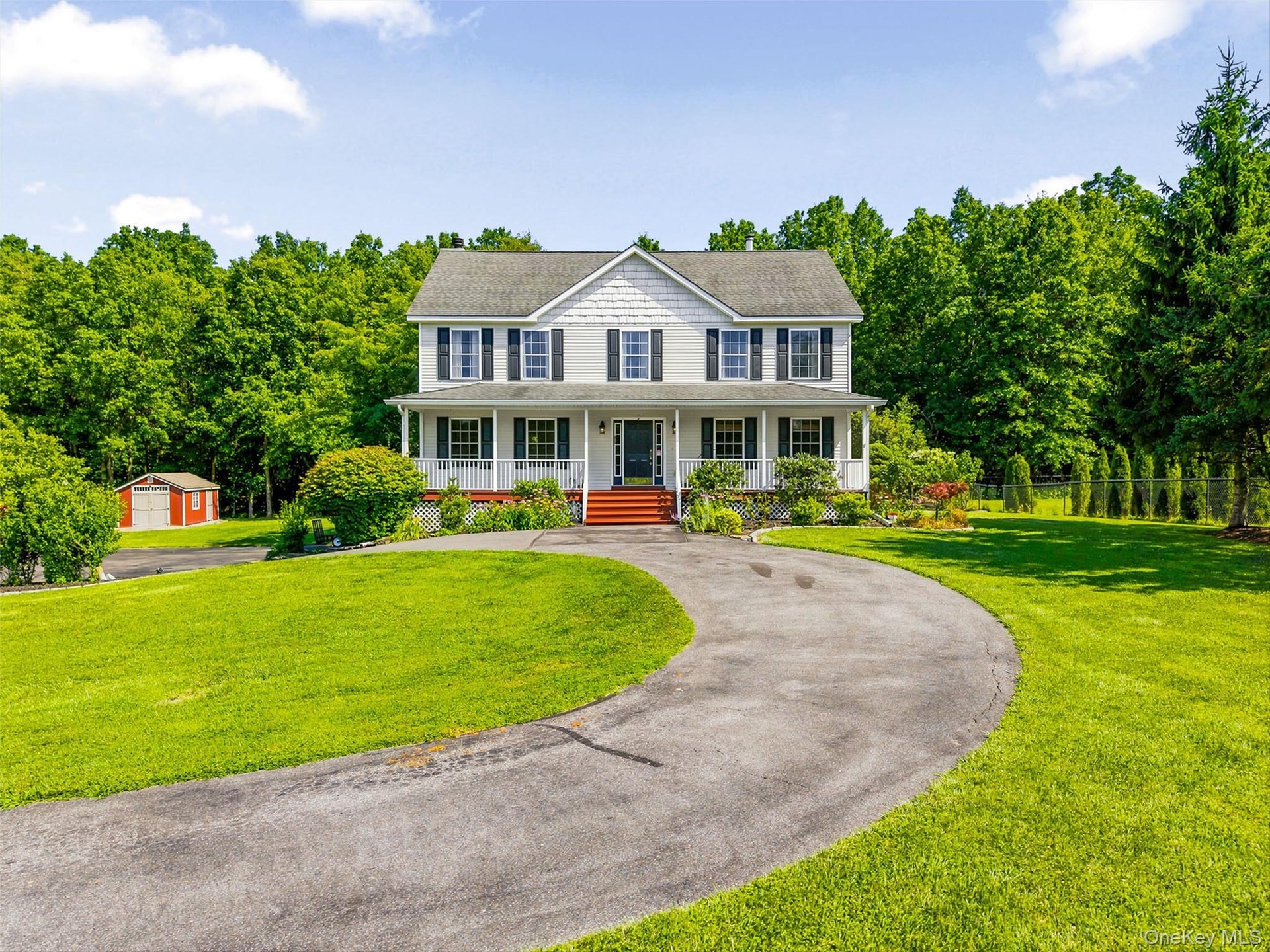 Front view with circular driveway.