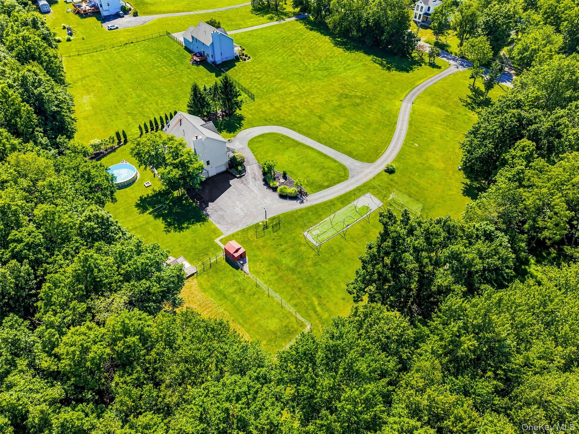 Aerial view of the side of the house and yard.