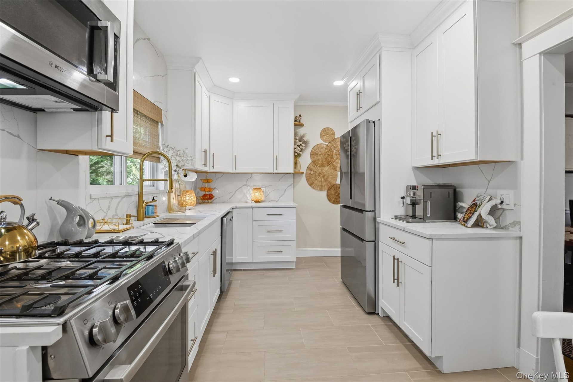 Beautifully renovated kitchen with stainless steel appliances and tiled backsplash (#220)