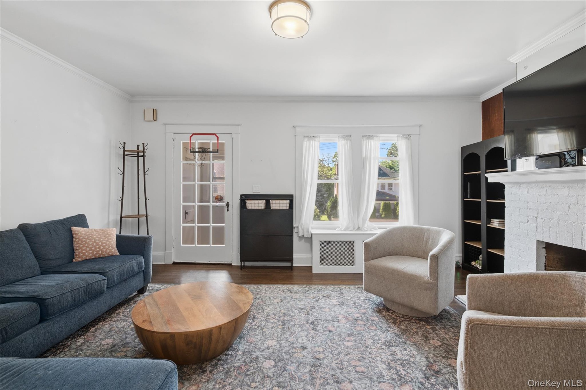 Living room with fireplace and hardwood flooring (#222)