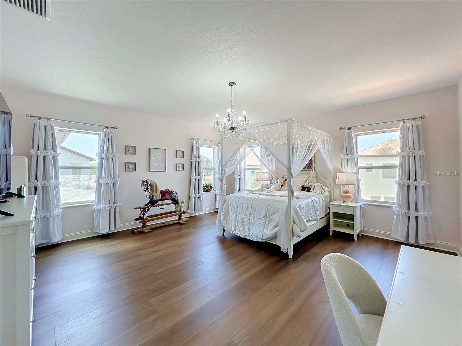 2nd primary suite upstairs with walk in closet and ensuite bathroom