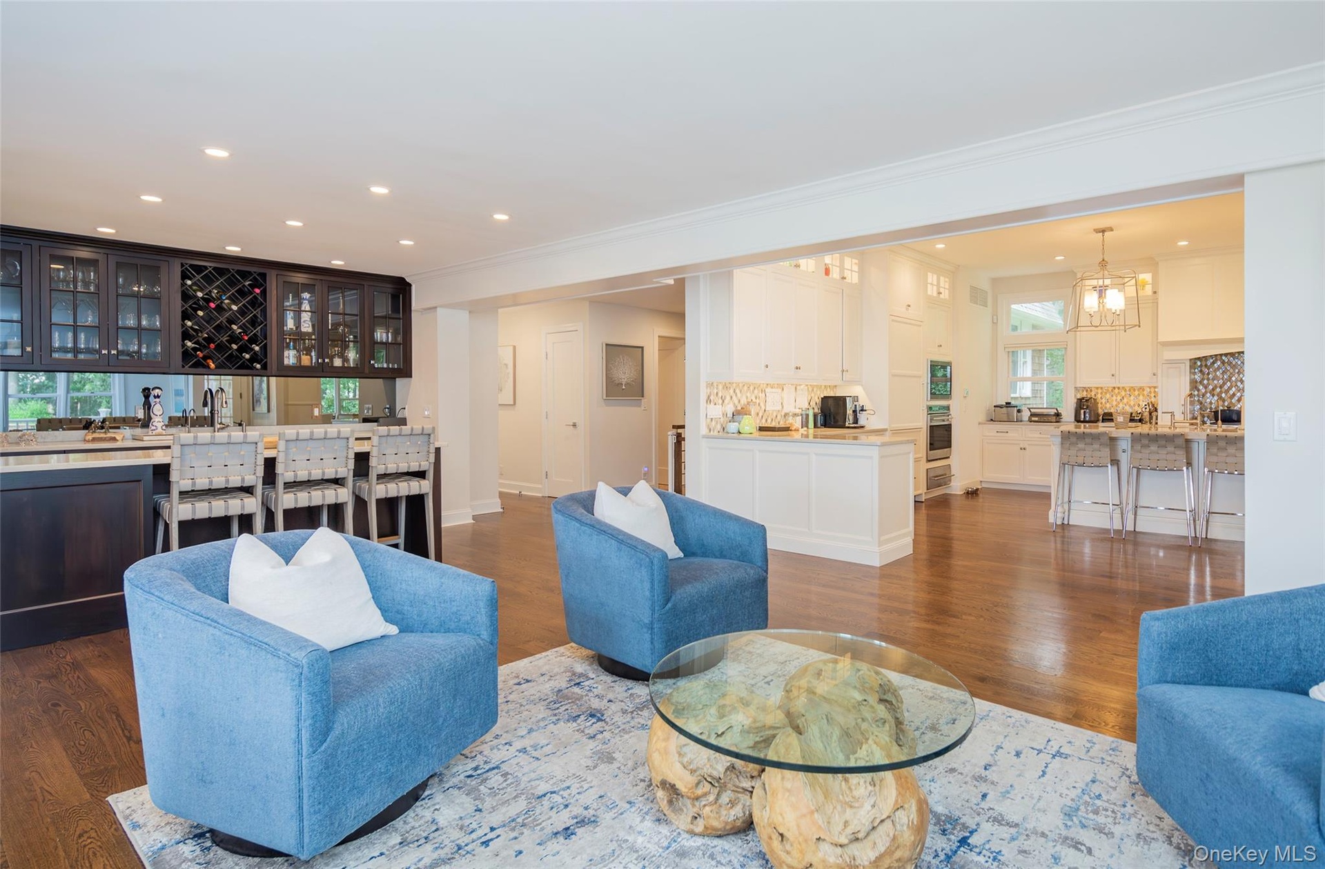 Open concept living space featuring wood-finish flooring
