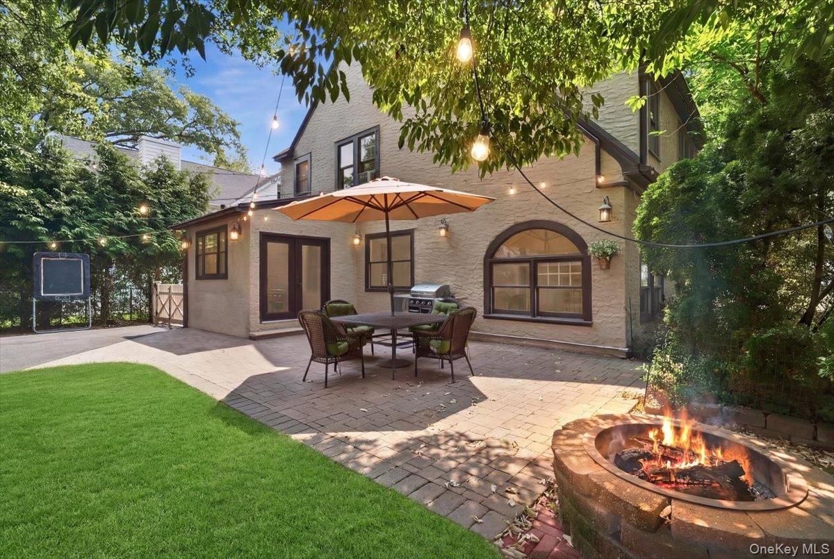 Enjoy seamless indoor-outdoor living with an expansive patio just off the kitchen, ideal for summer entertaining.