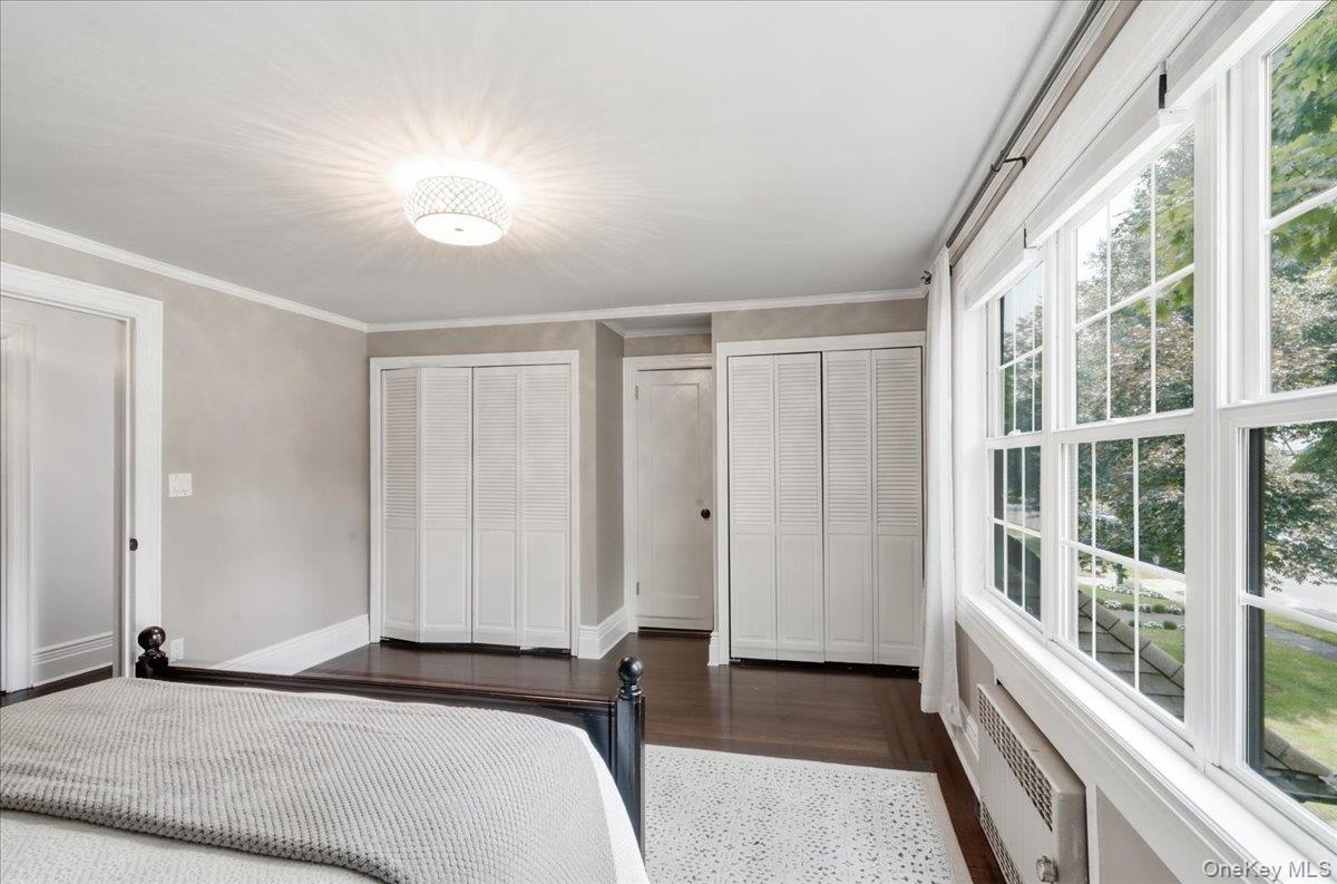 Primary bedroom with beautiful Pella Windows and 2 double closets