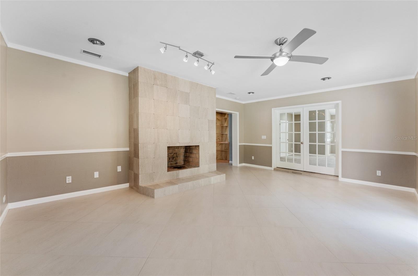 formal living room or dining room with french doors to bonus space