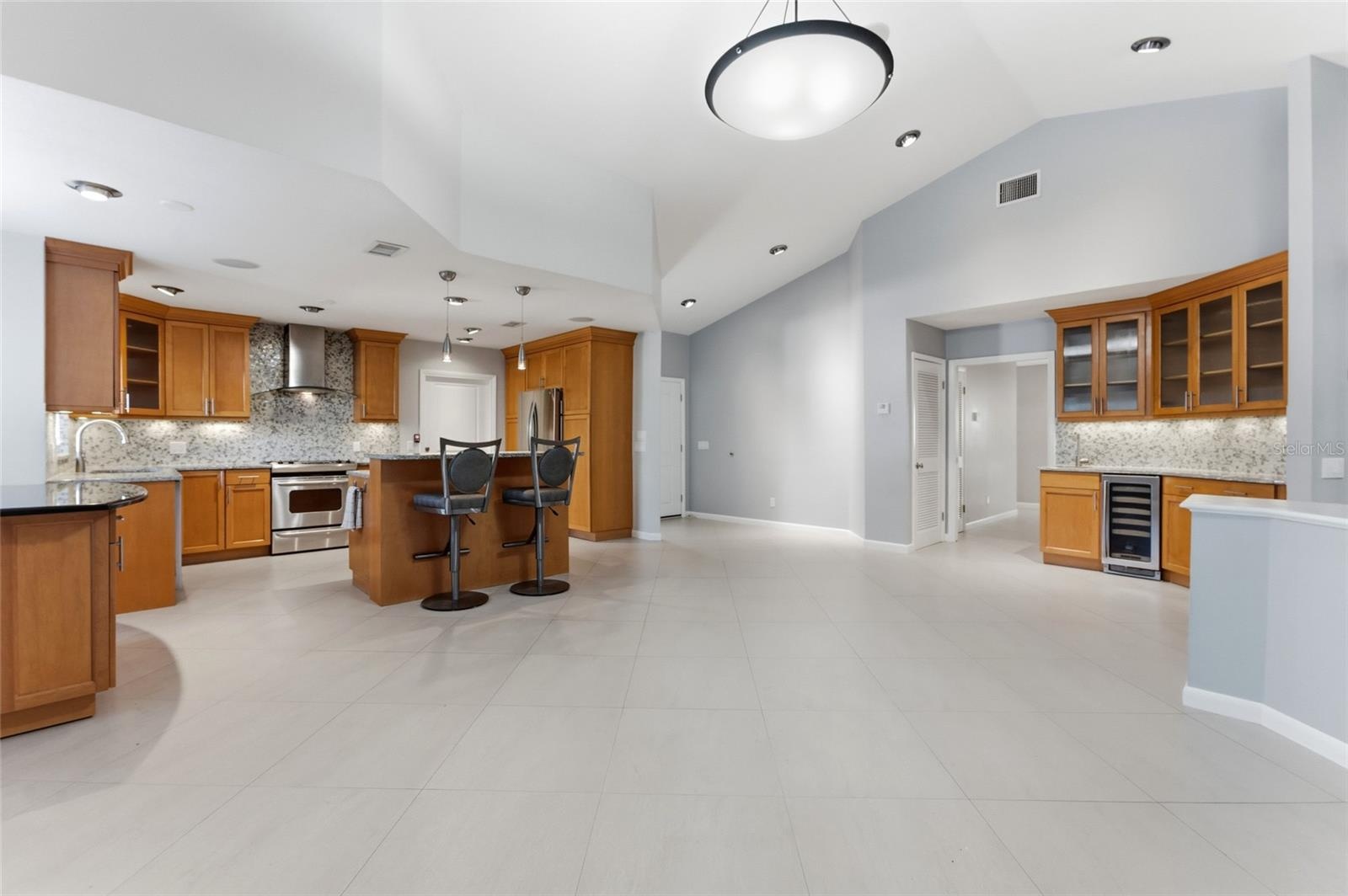 Kitchen with wet bar on right of picture