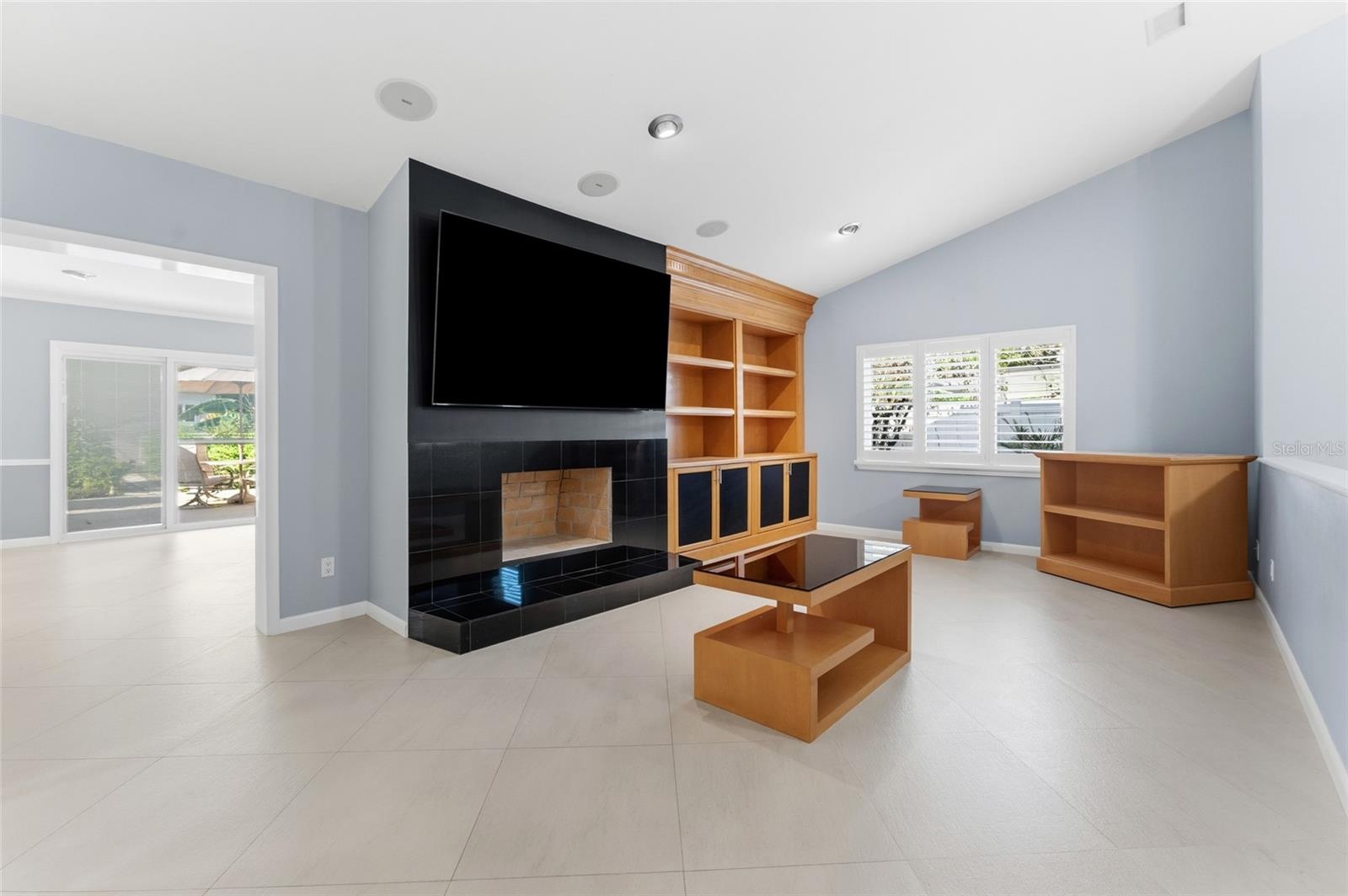 family room with fireplace and built in shelves