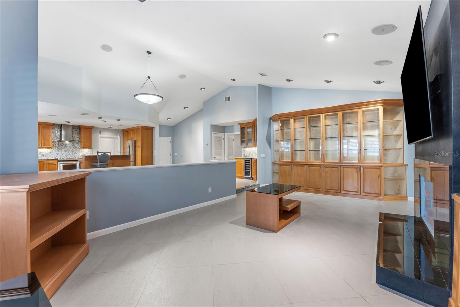 another view of family room with built in cabinets