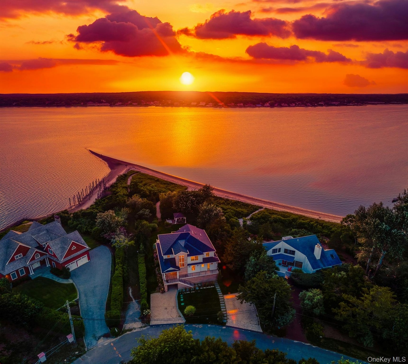 Waterfront property featuring a private beach and direct water access