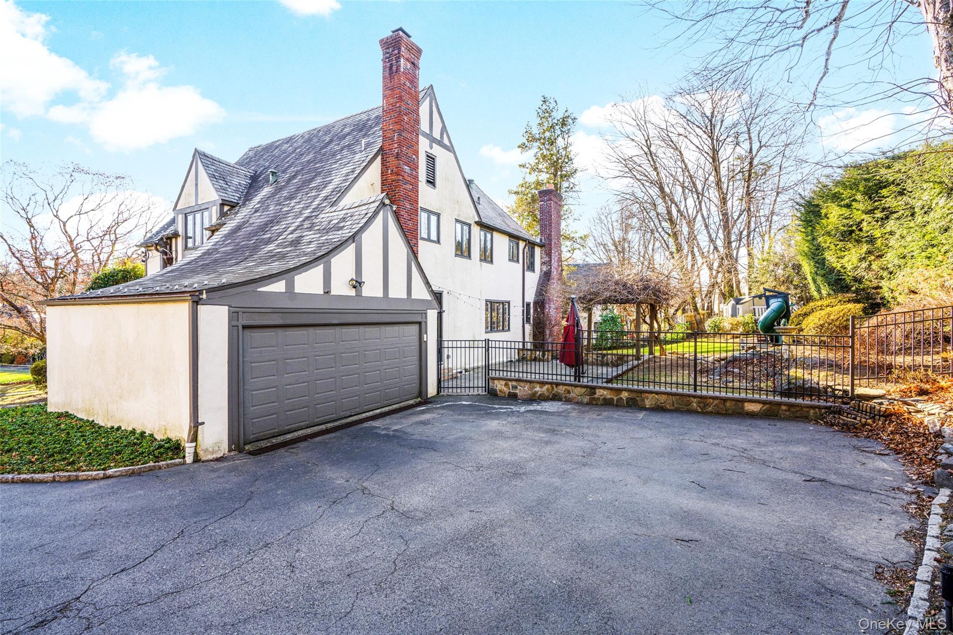 Big driveway and view of garage.