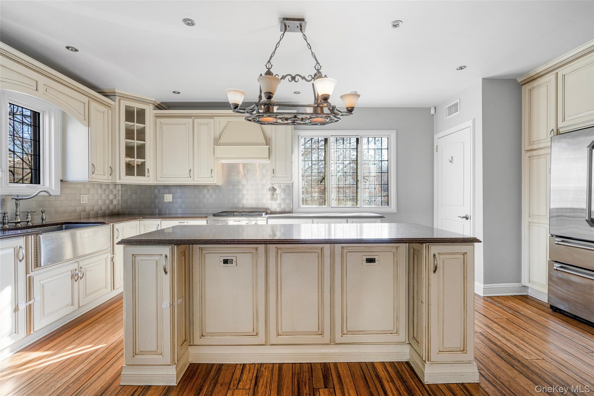 Kitchen with center island and room for 2-4 stools.