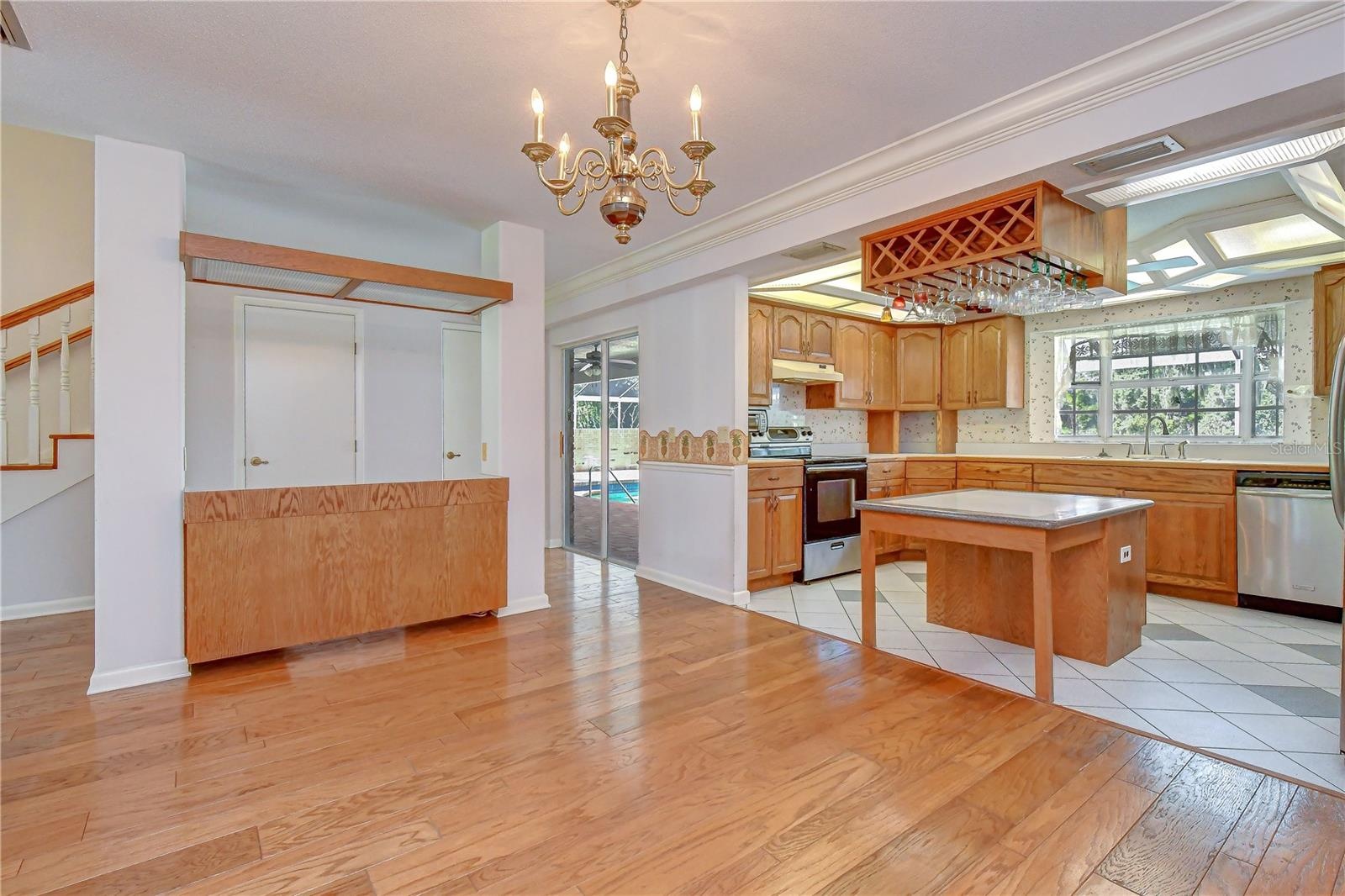 Spacious kitchen overlooking the pool and lanai.