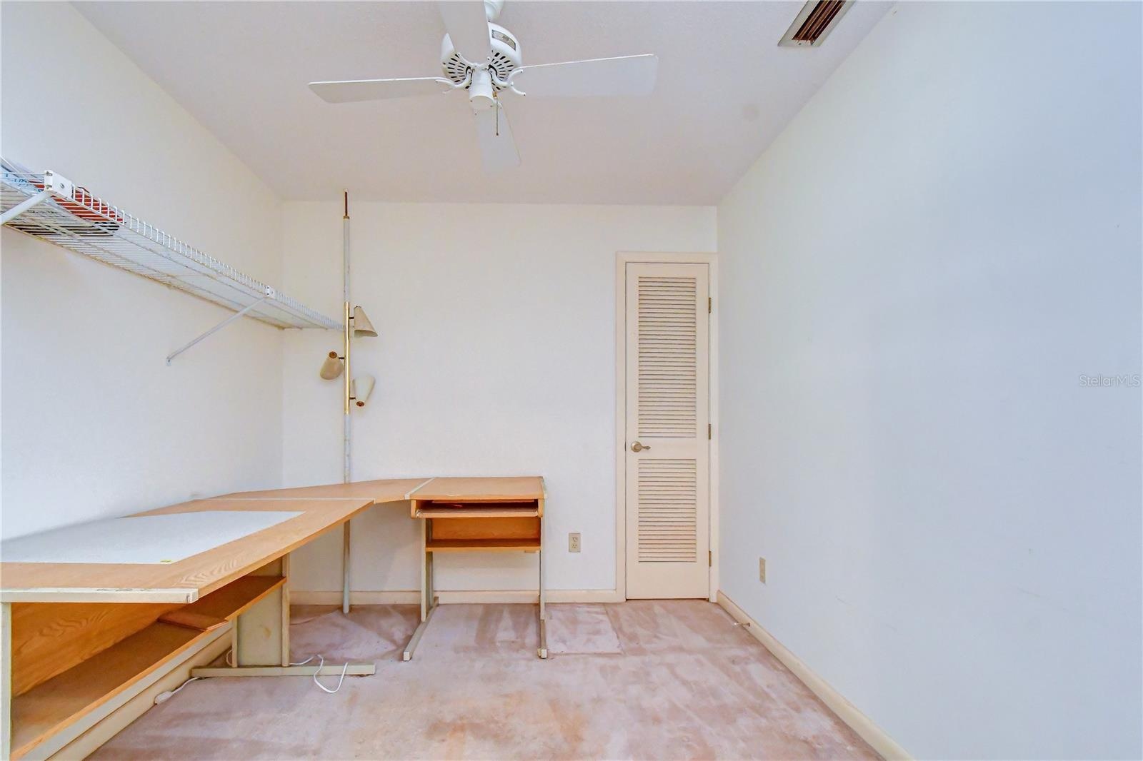 Private office with closet offering bedroom flexibility.