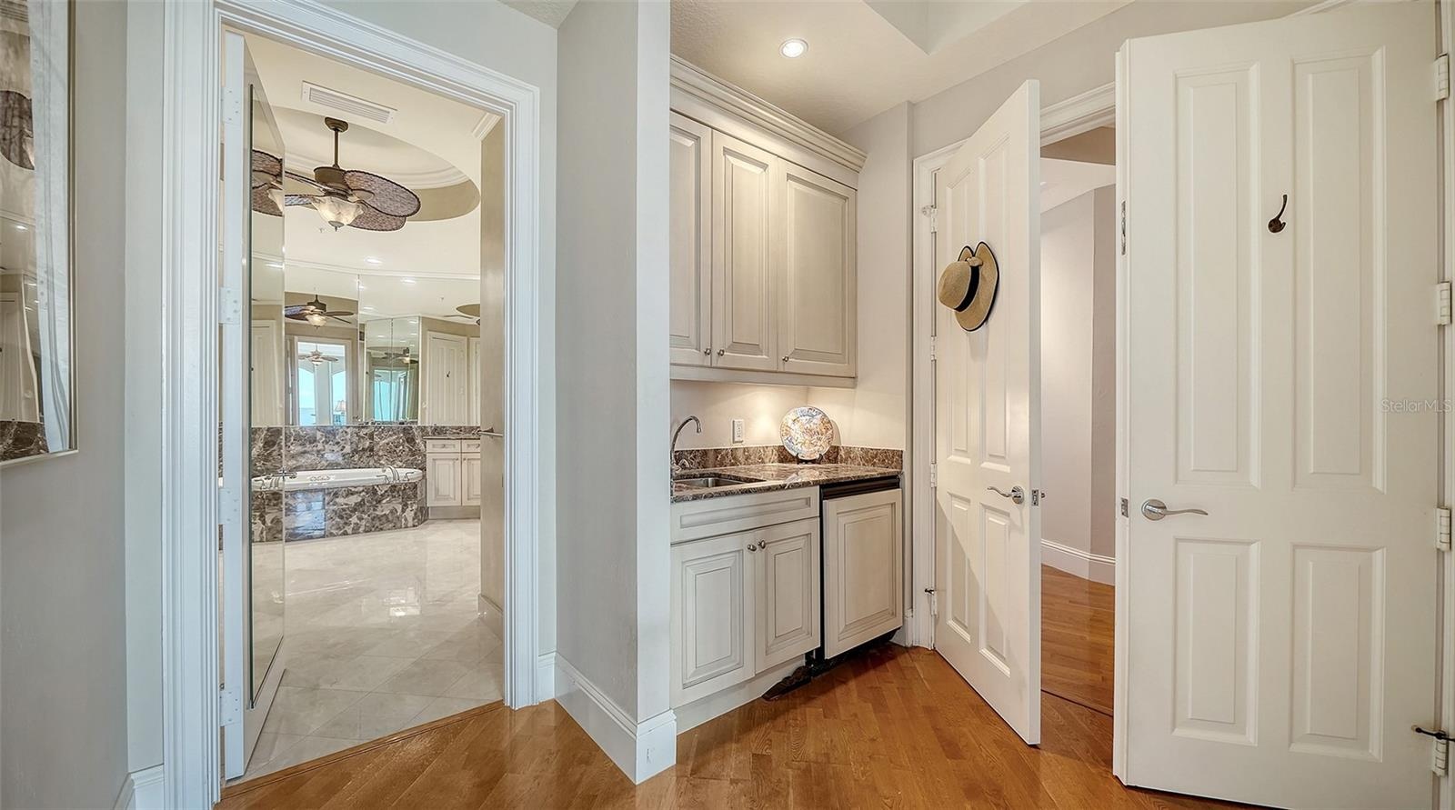 PRIMARY SUITE WITH WET BAR AND ENSUITE BATH