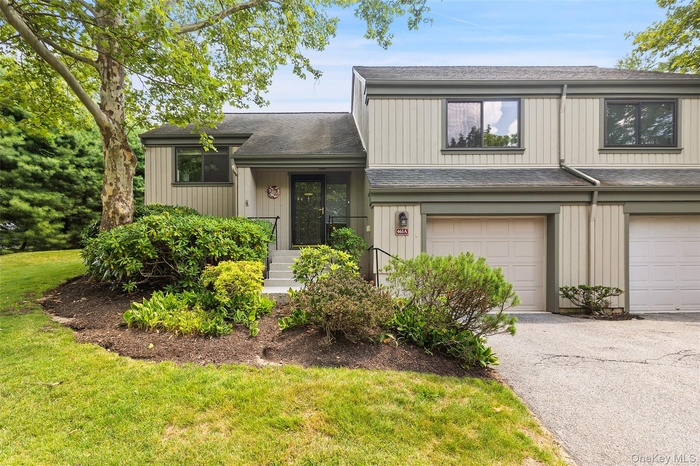 Lovely landscaping fronts this End Unit Fairview model with Attached Garage.
