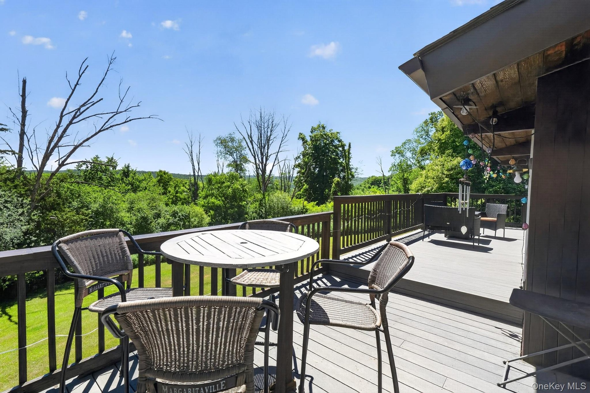 Expansive multi-level deck featuring composite decking and dark wood railings