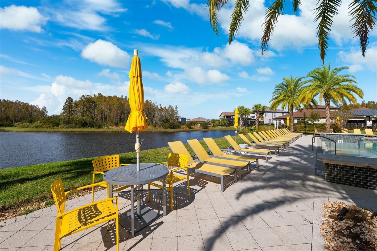 Resort style community clubhouse with a community pool, fitness center and lake front pool.