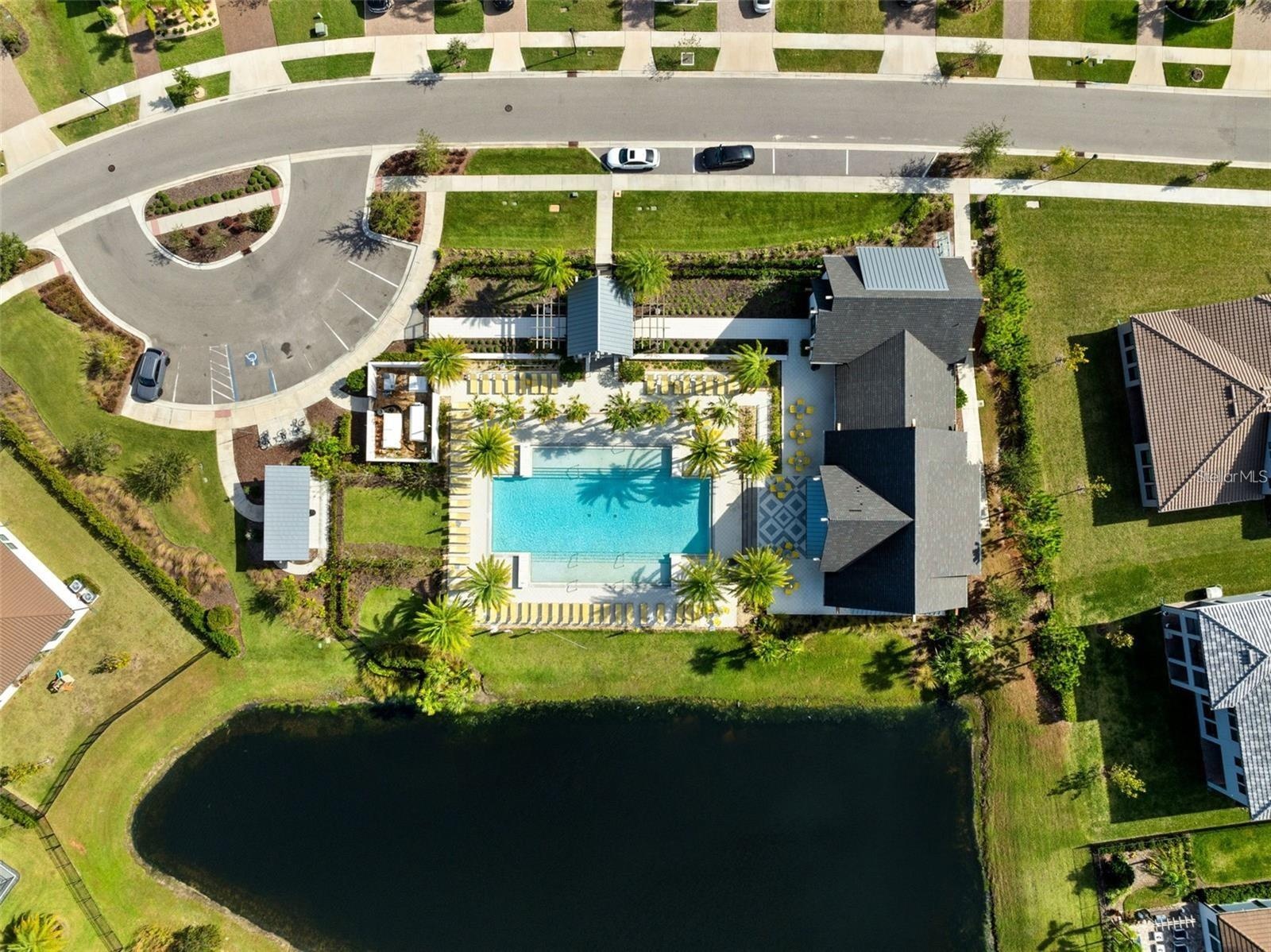Resort style community clubhouse with a community pool, fitness center and lake front pool.