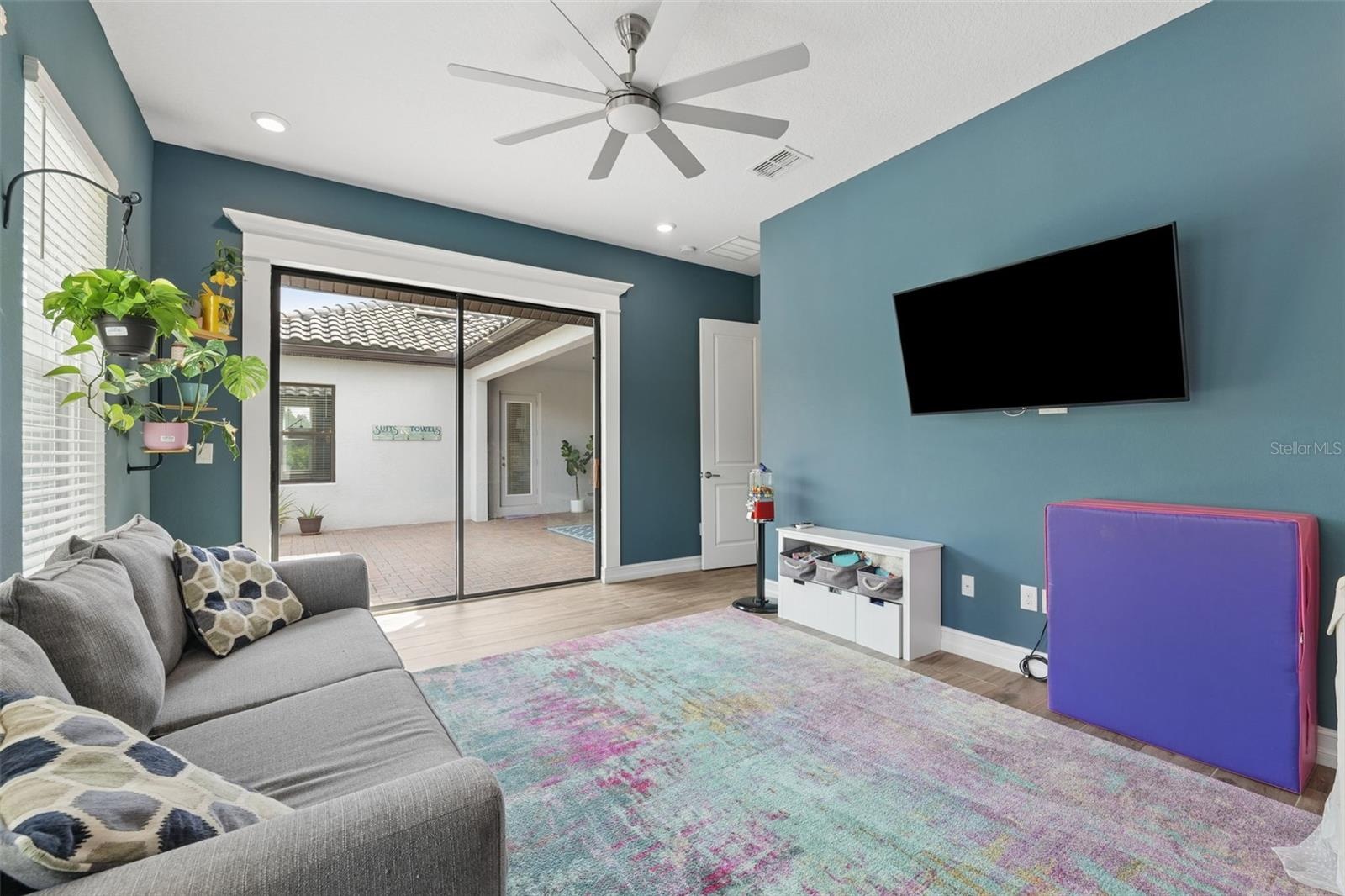The bonus room offers direct access to the pool and guest bathroom.