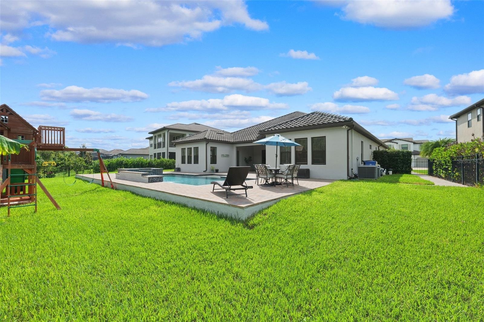 Beyond the pool deck you will find plenty of green space for kids and pets not to mention the view of the lush green preserve.