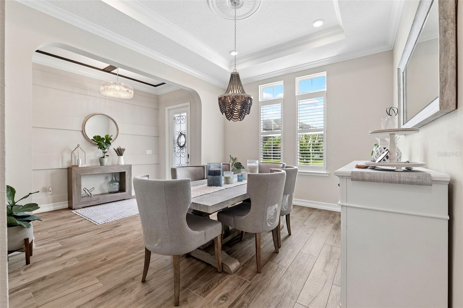 The dining room is lit with natural lighting and warm bright colors.