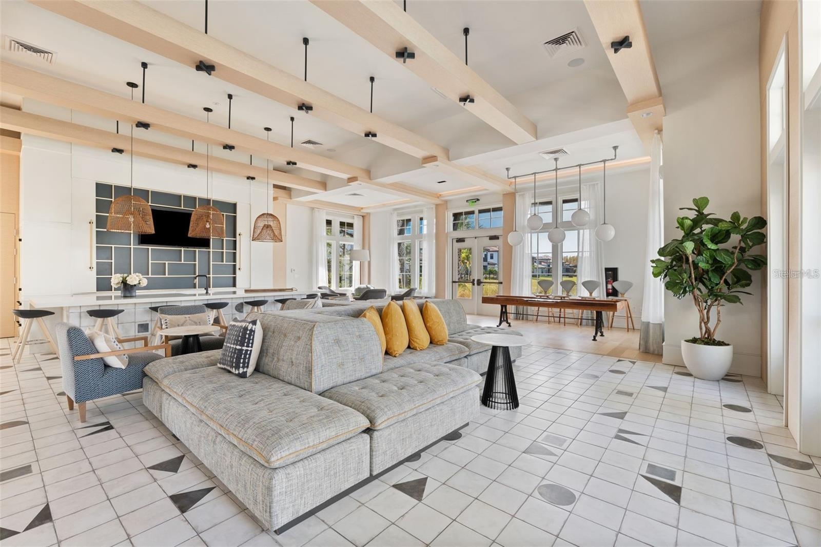Resort style community clubhouse with a community pool, fitness center and lake front pool.