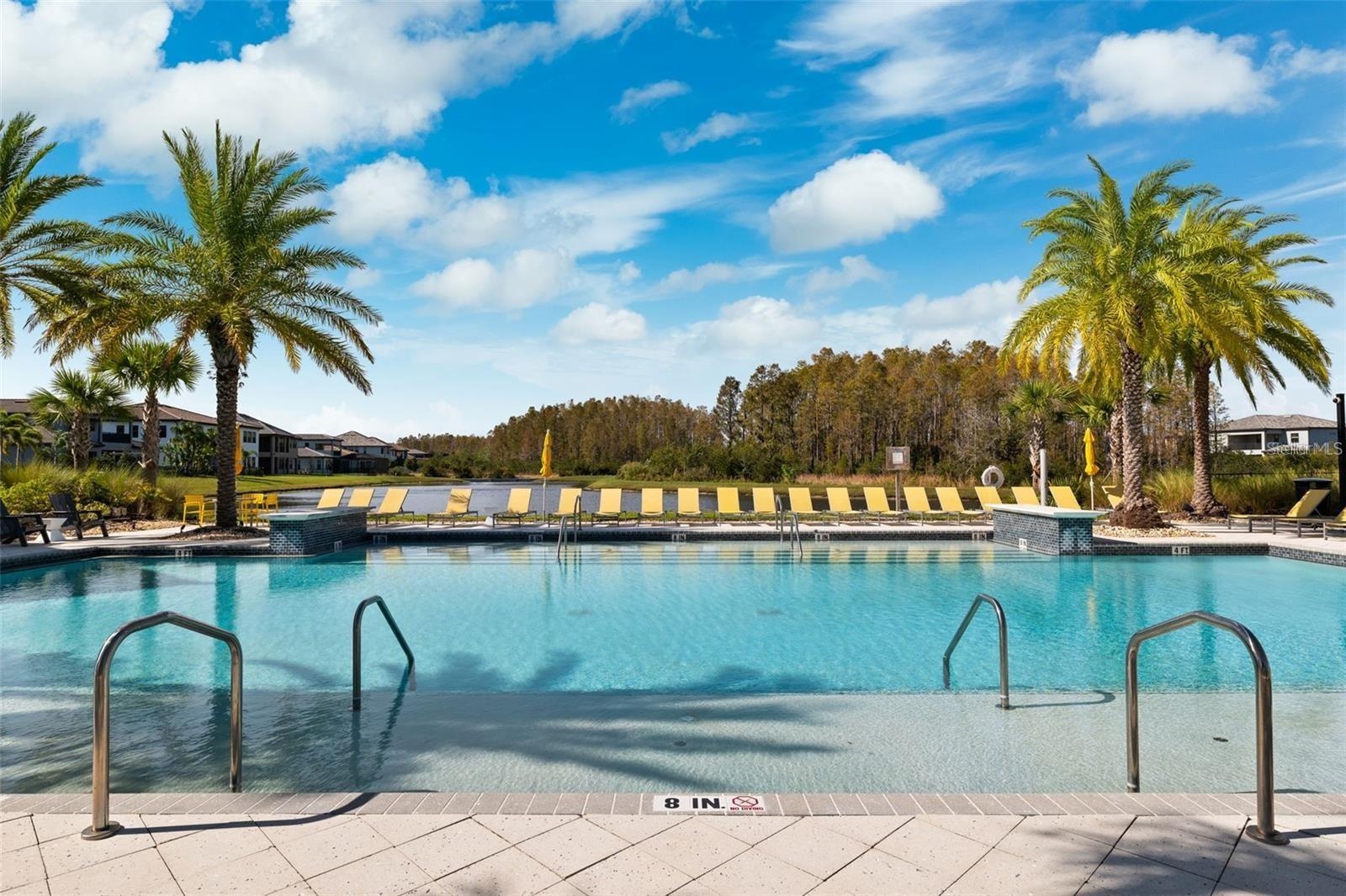 Resort style community clubhouse with a community pool, fitness center and lake front pool.