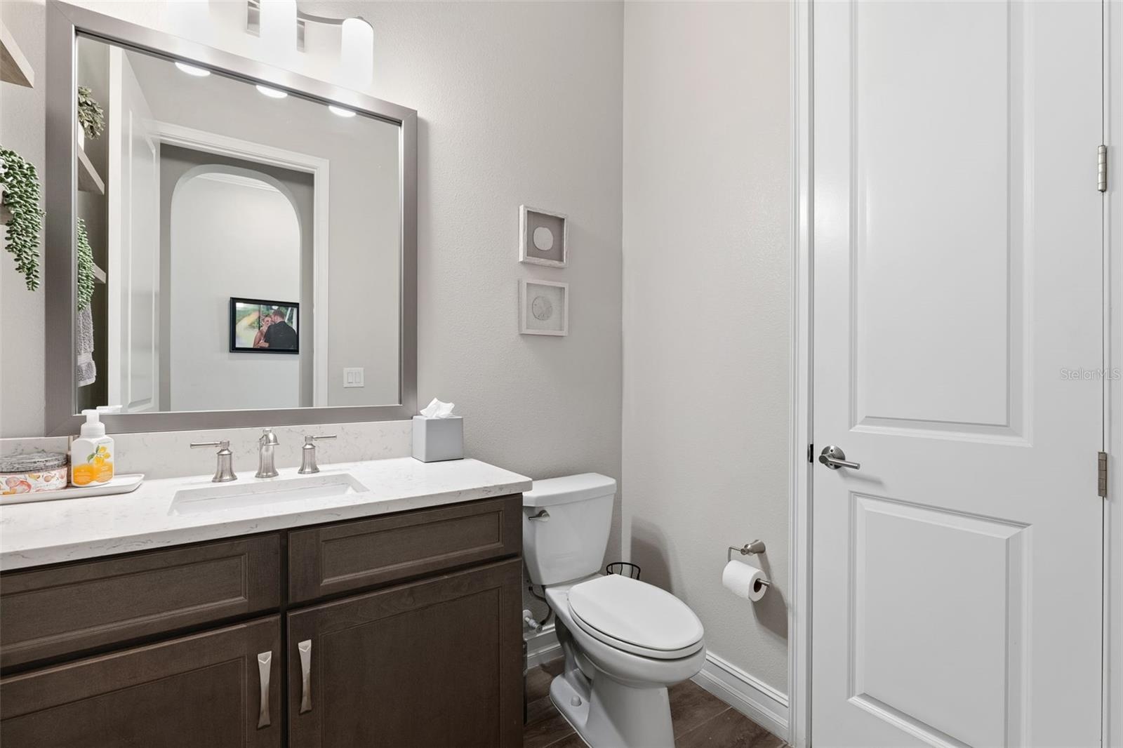 Half bath located off of the main living room and kitchen is convenient for guest so that they do not have to go through any of the bedroom areas.