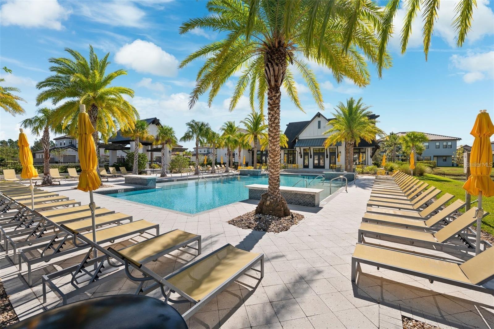 Resort style community clubhouse with a community pool, fitness center and lake front pool.