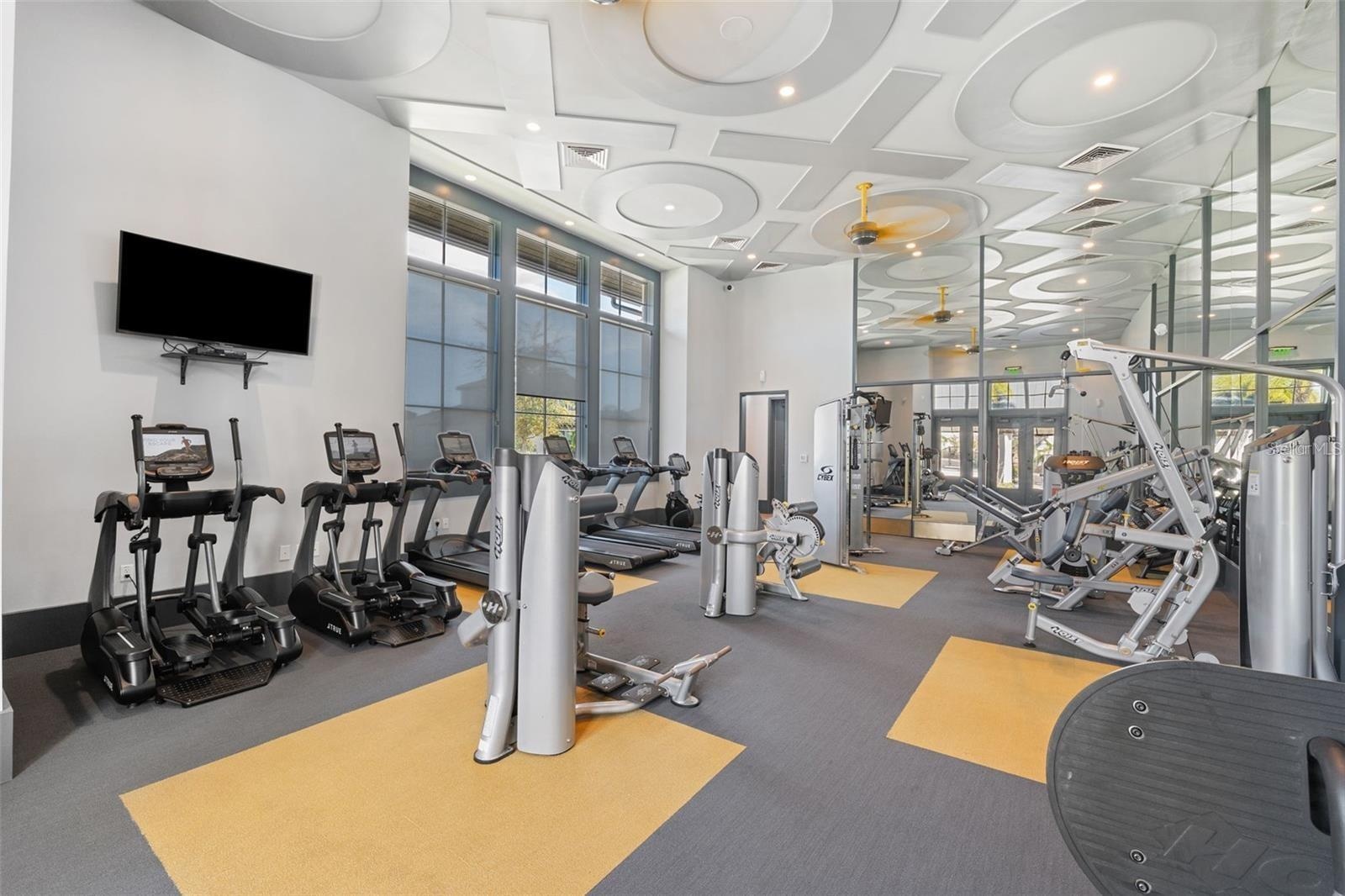 Resort style community clubhouse with a community pool, fitness center and lake front pool.
