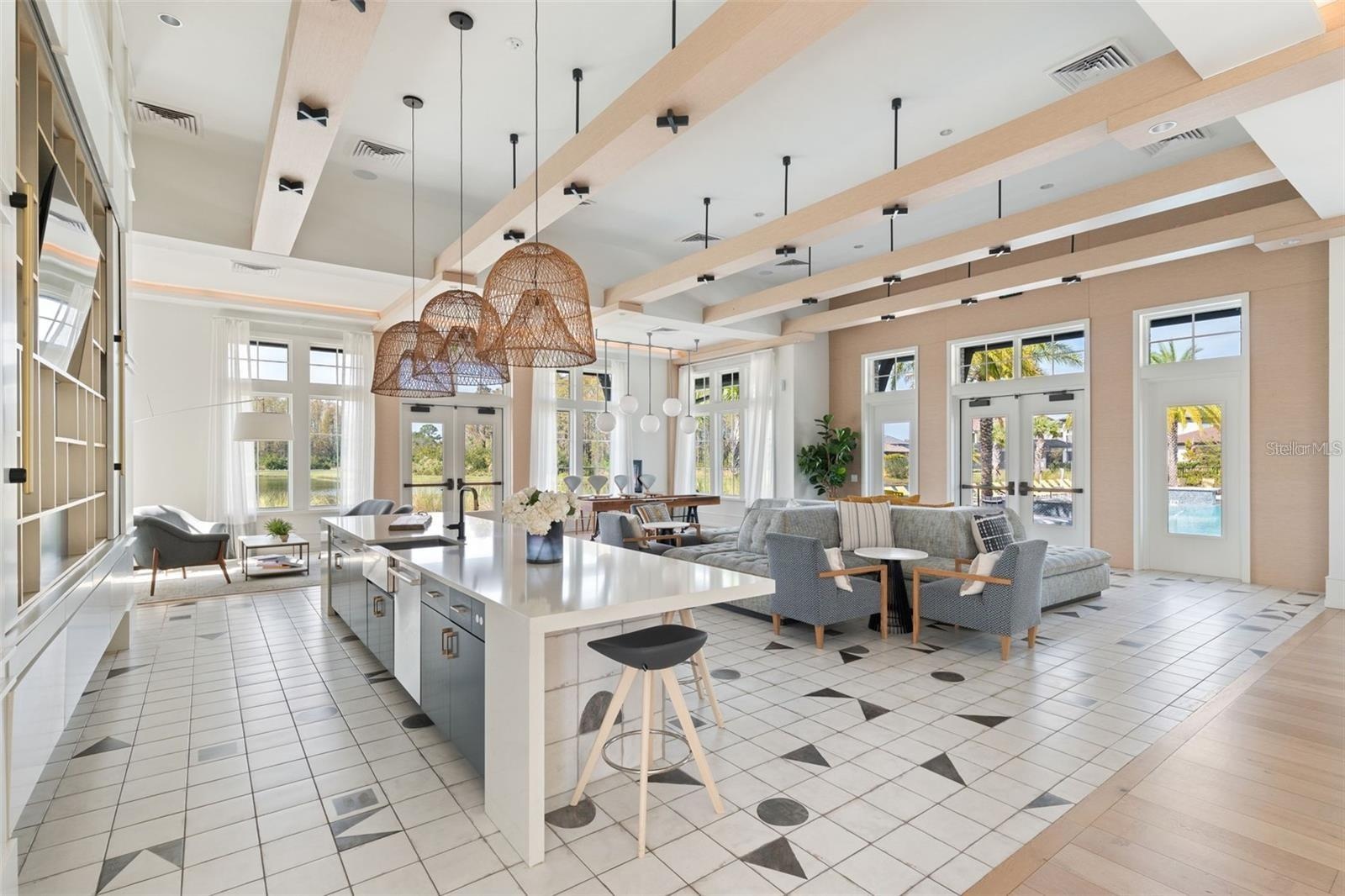 Resort style community clubhouse with a community pool, fitness center and lake front pool.