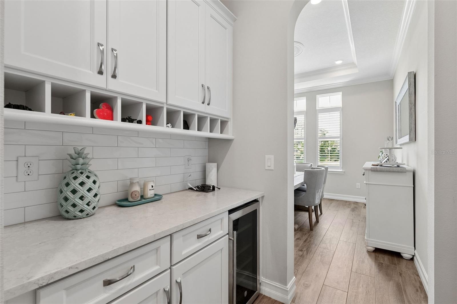 This bar area is conveniently located between the kitchen and formal dining room.