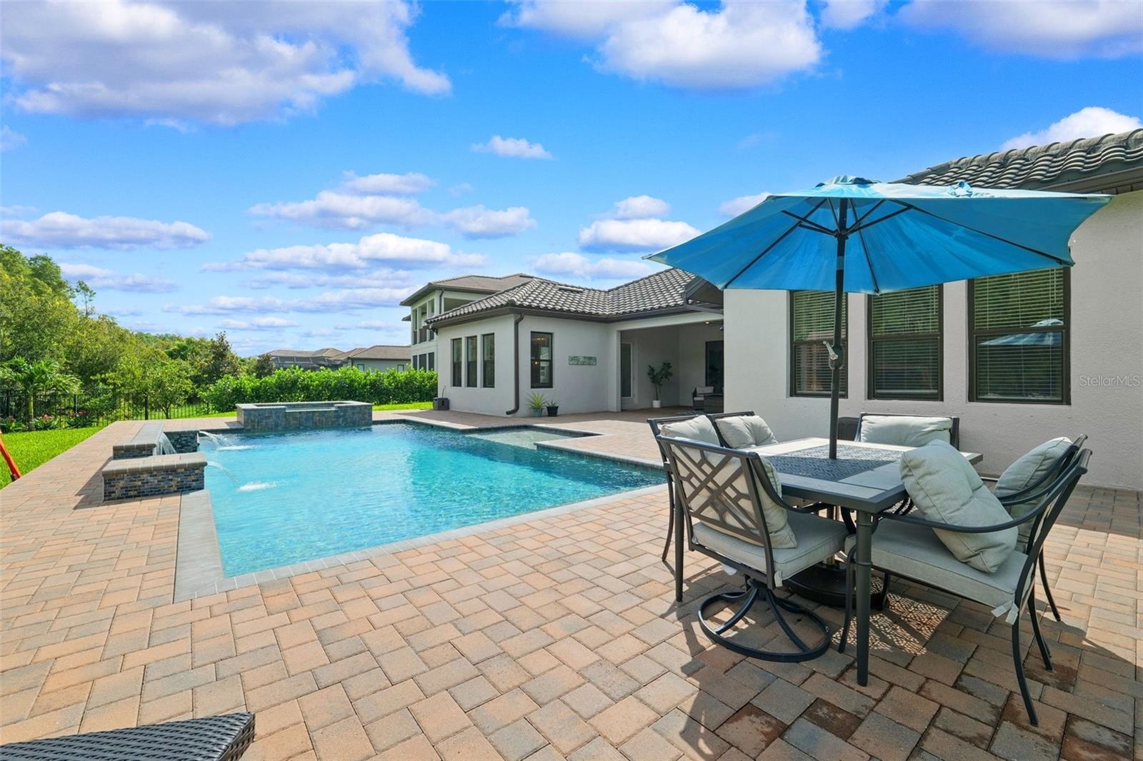 The backyard is the focal point of this property.  Oversized patio with a heated salt pool and built-in spa.