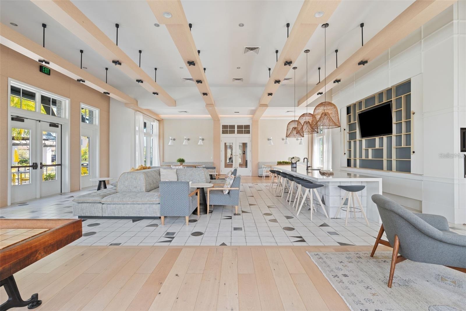 Resort style community clubhouse with a community pool, fitness center and lake front pool.