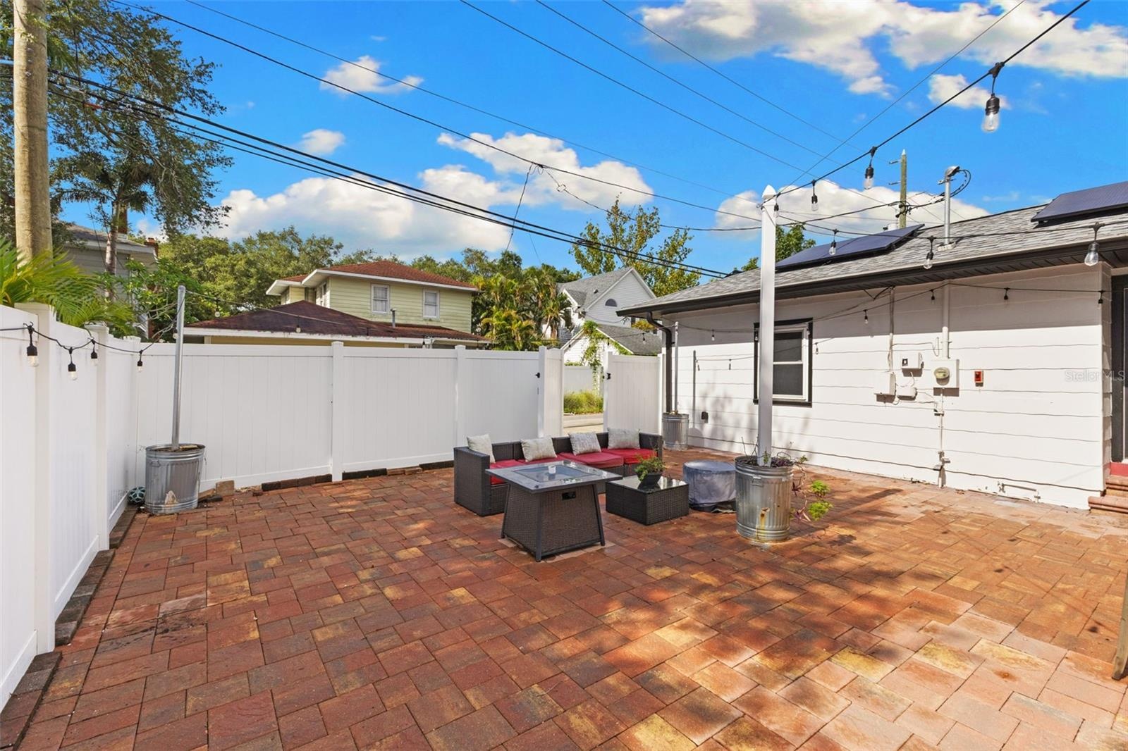 Backyard with Pavers and Vinyl Fence