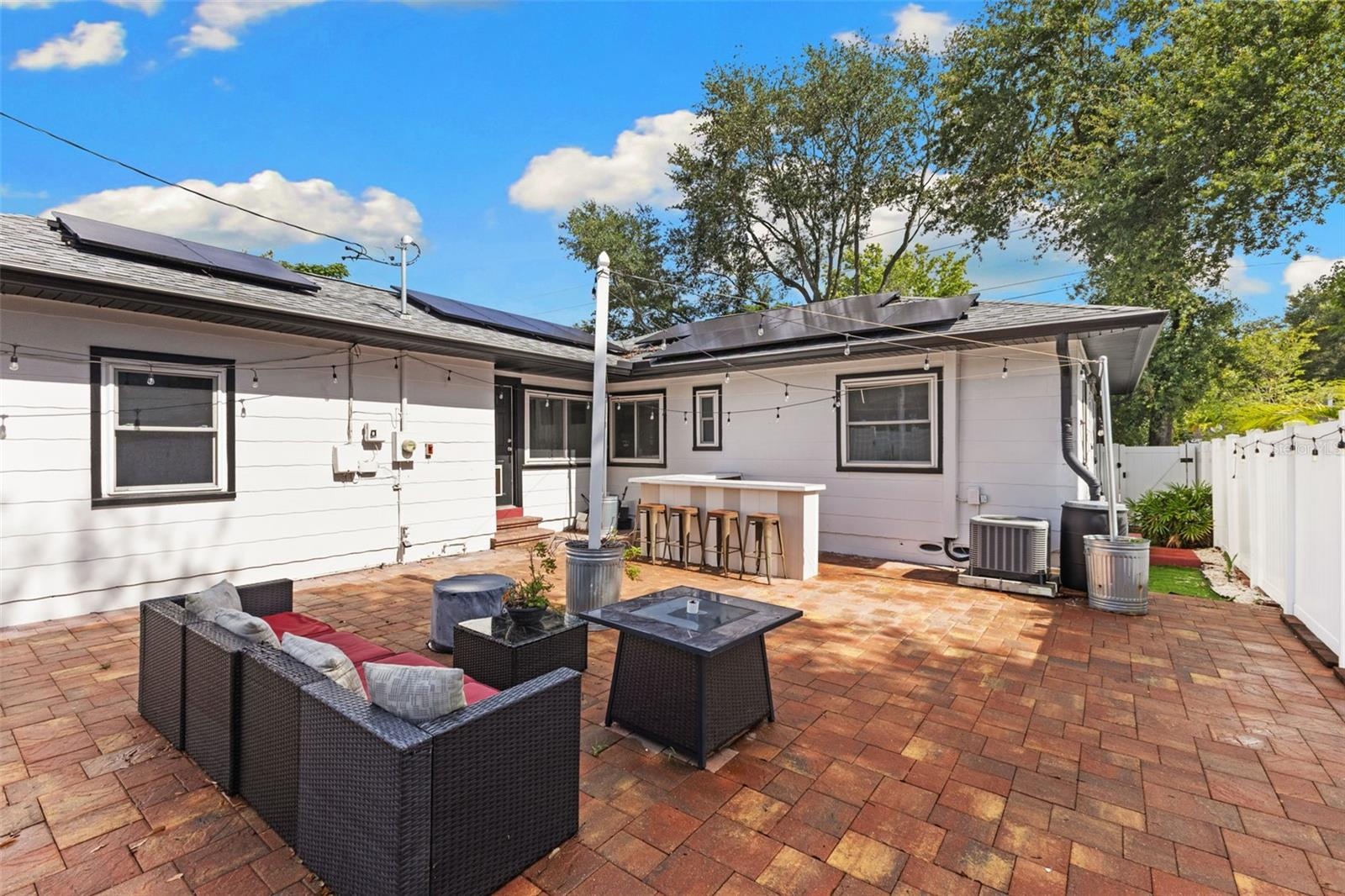 Backyard with Pavers and Vinyl Fence