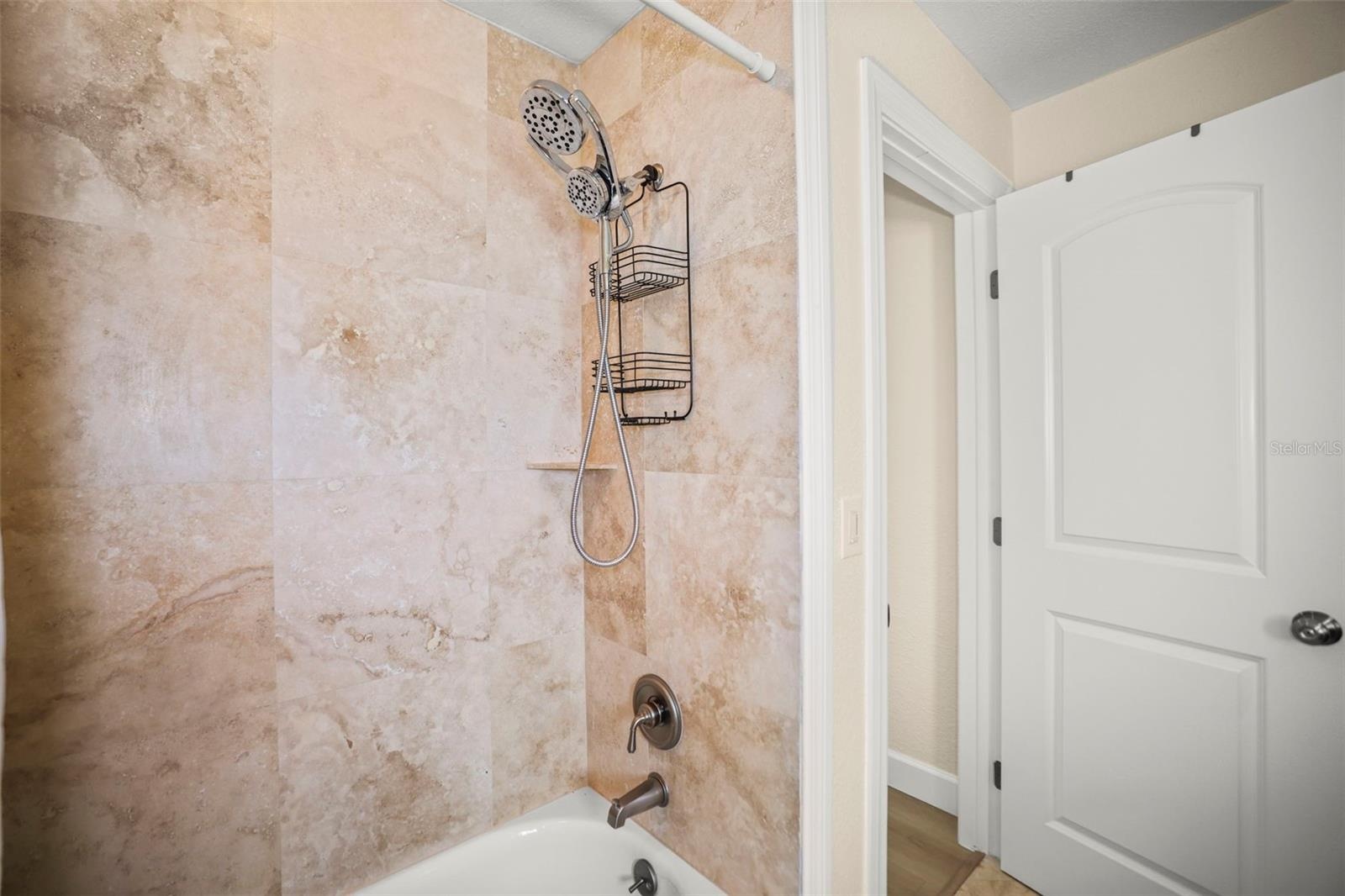 Second bathroom shower and tub combo.