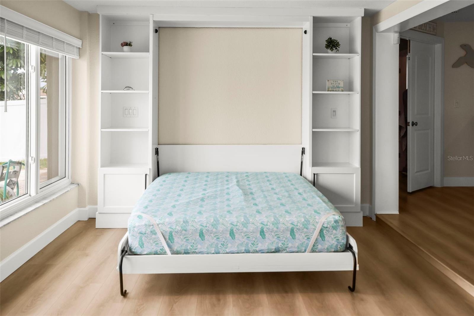 Directly facing open Murphy bed.