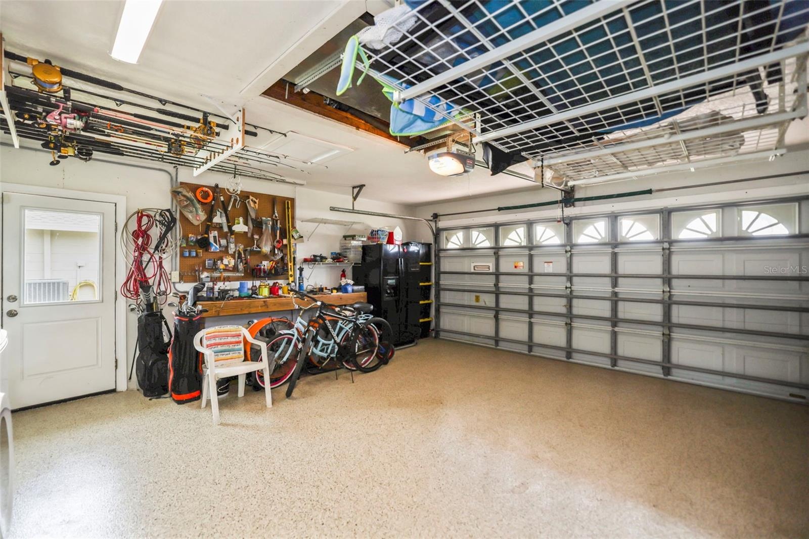 Garage interior facing closed garage door.