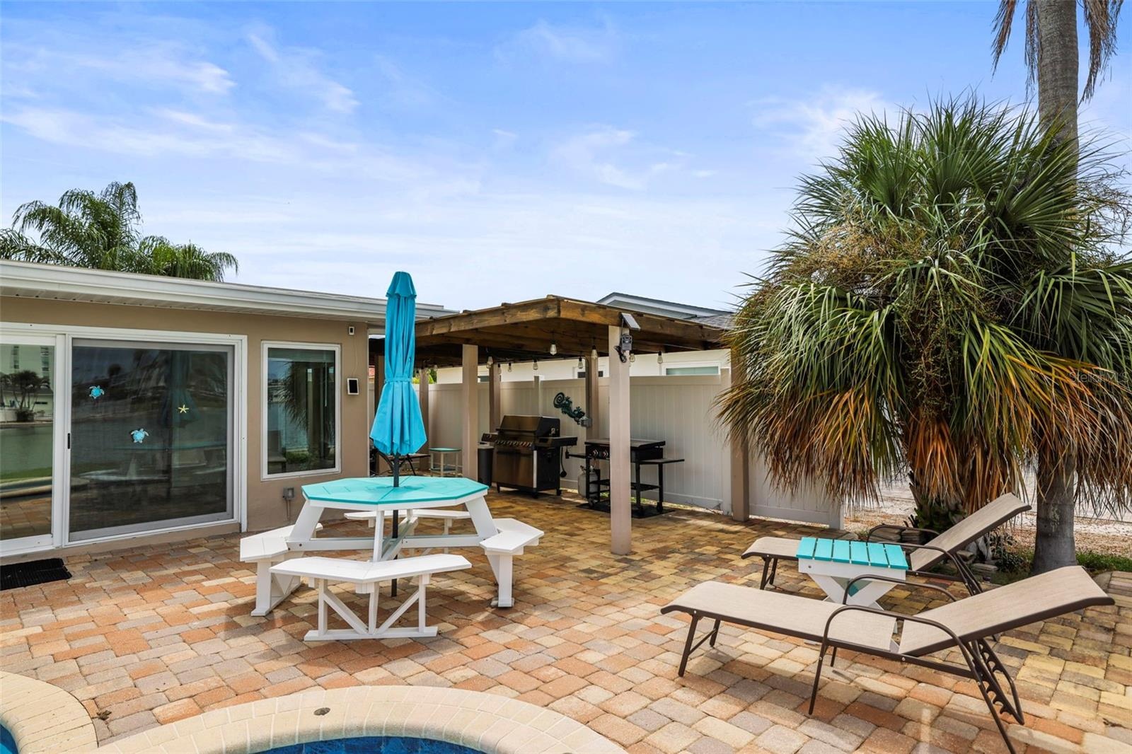 Pool patio seating and lounge area.