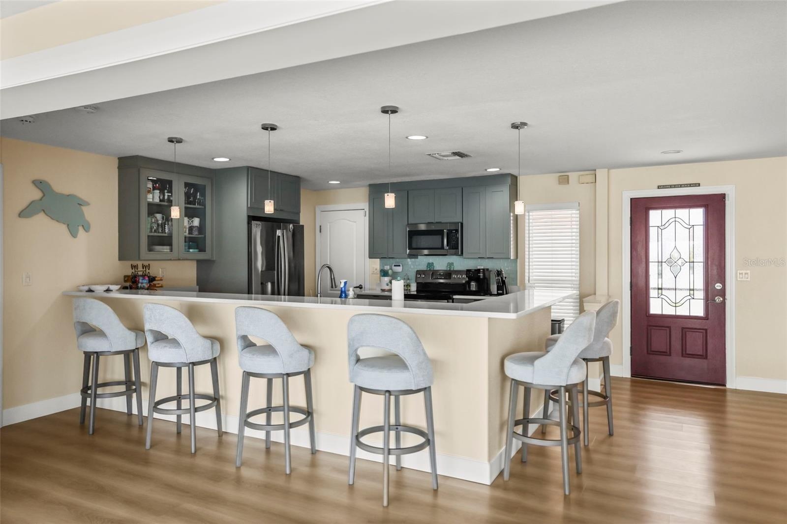 Kitchen breakfast bar facing toward the kitchen.