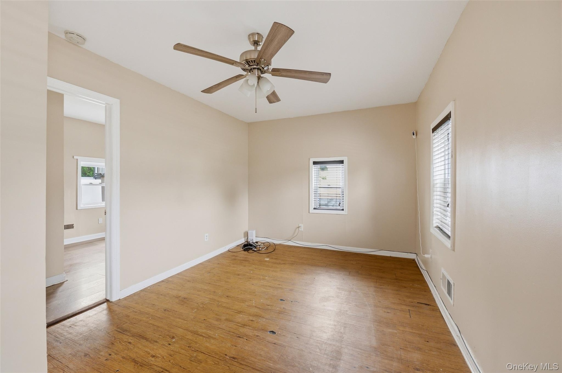 Freshly Painted Living room with view of the 1st floor bedroom