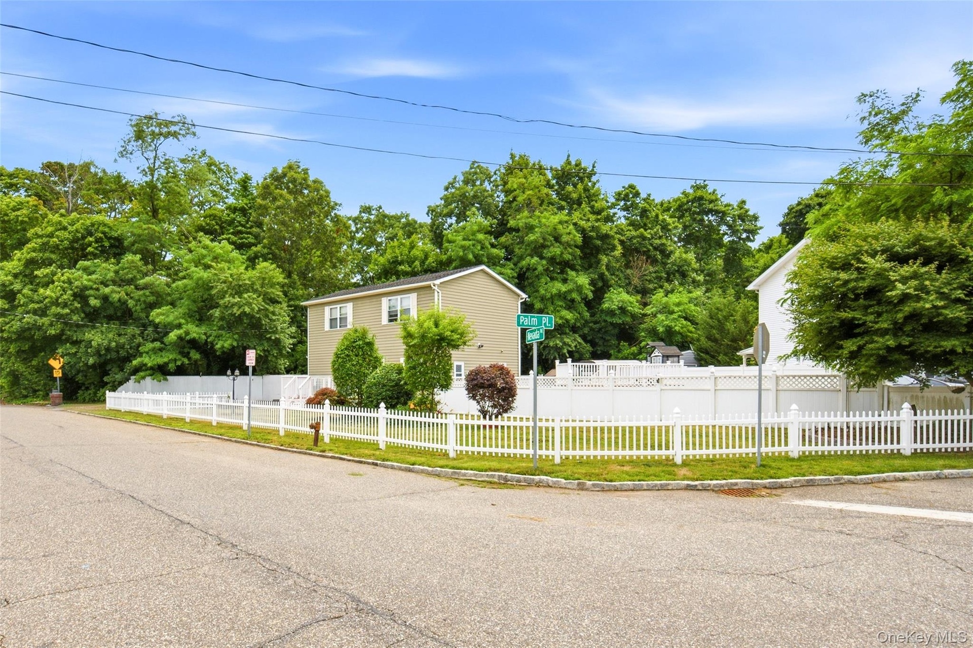 White picket fence around the corner of 14 Nevada Road