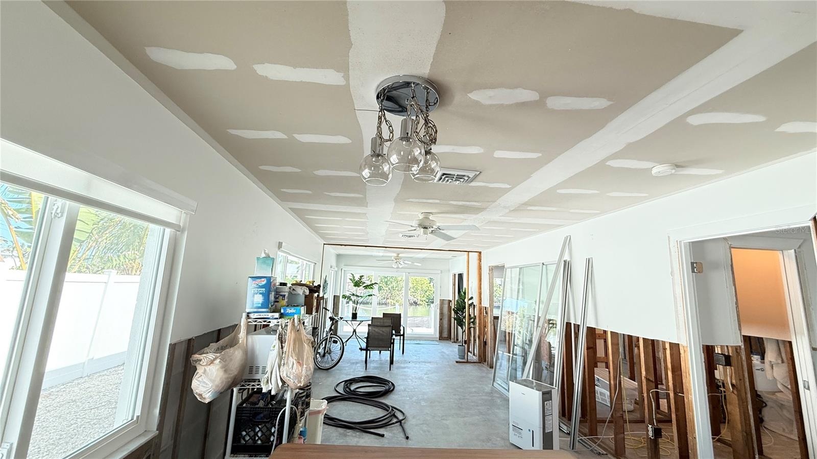 Dining and living areas with both bedrooms and bathrooms just off the living area