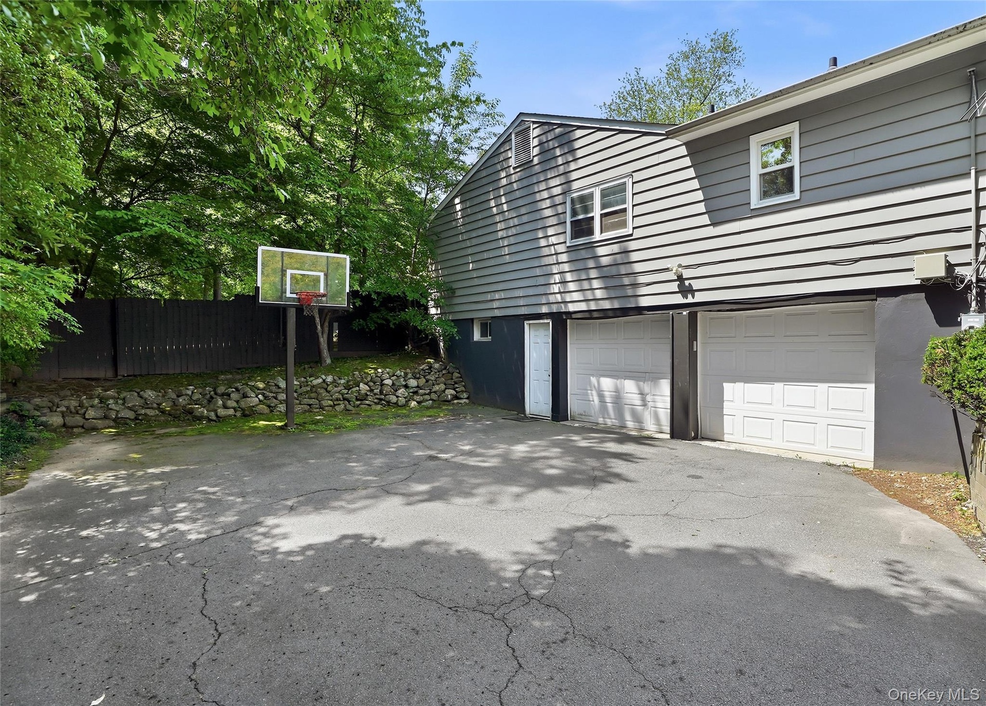 Driveway with basketball hoop