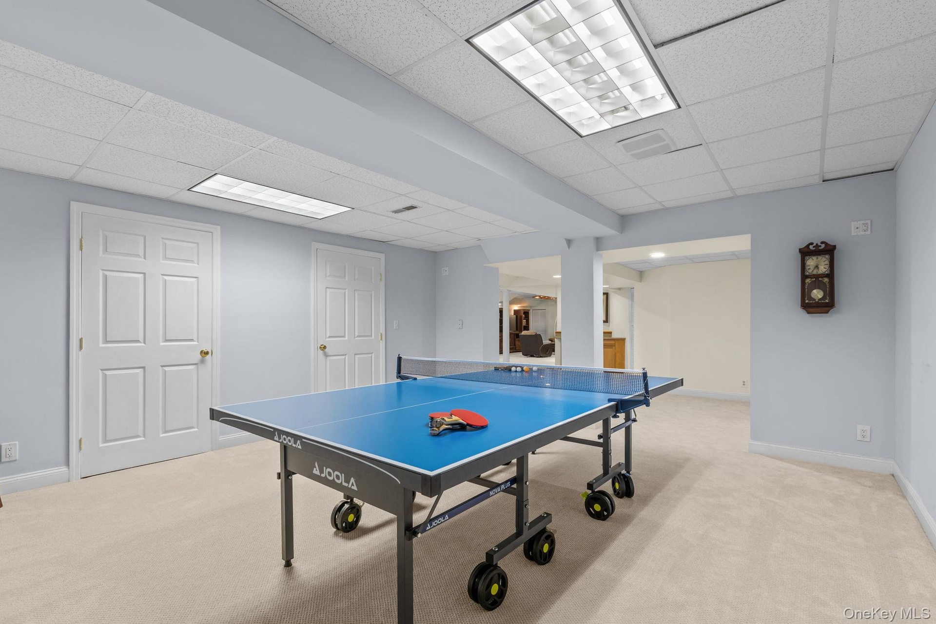 The finished lower level includes a game room with convenient storage and room for everyone to enjoy.