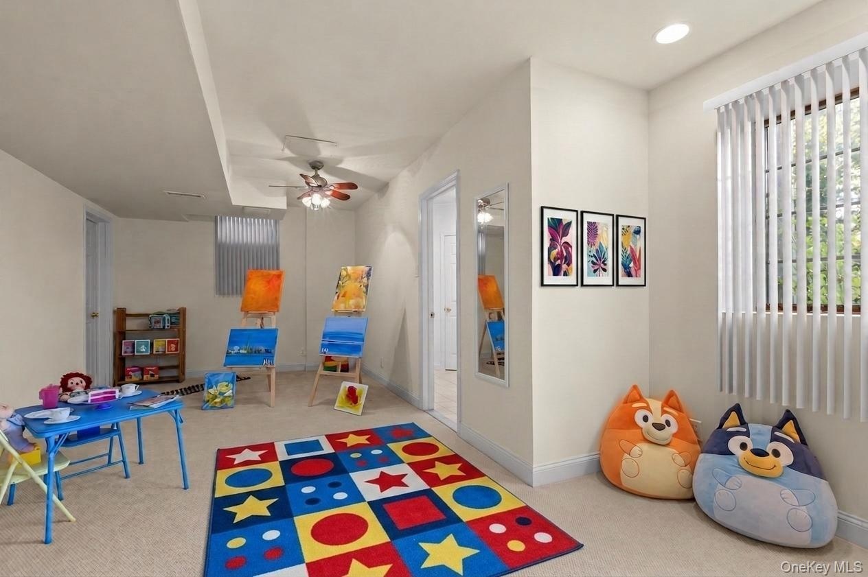 Currently used as a playroom, this versatile lower-level space offers wall-to-wall carpeting, an expansive storage closet, and endless possibilities f