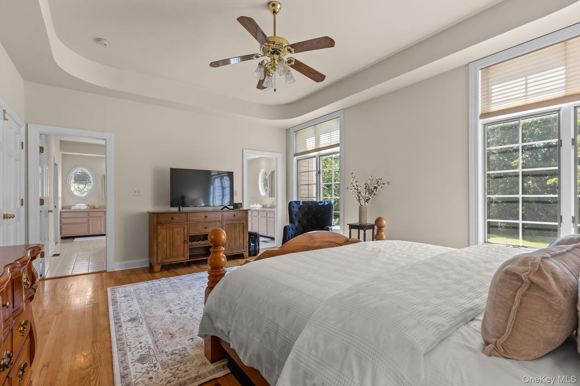 The first-floor primary suite blends comfort, sophistication, and accessibility.
