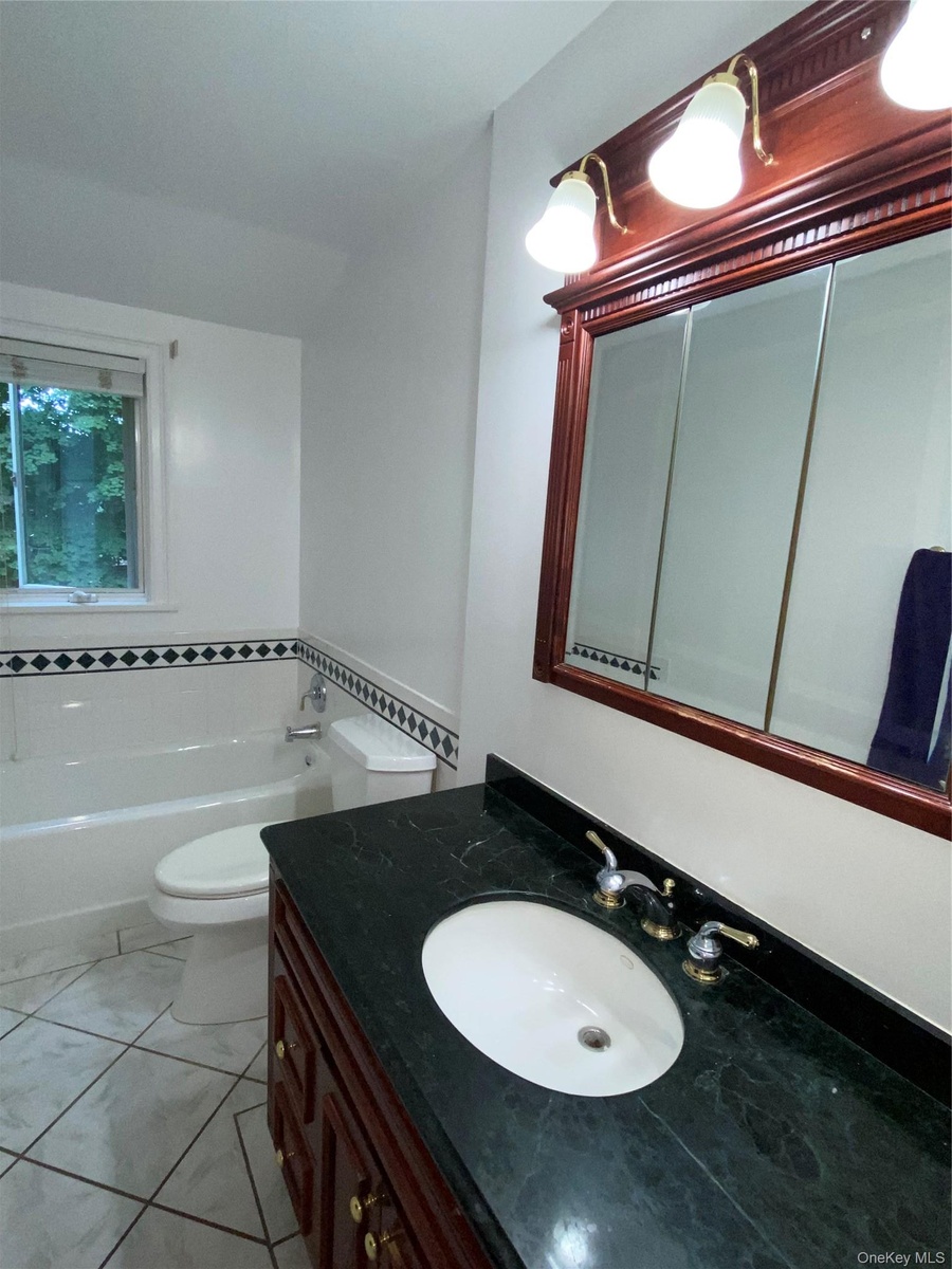 Bathroom #1 on upper level with tub
